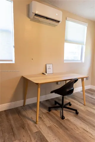 a view of a workspace with furniture