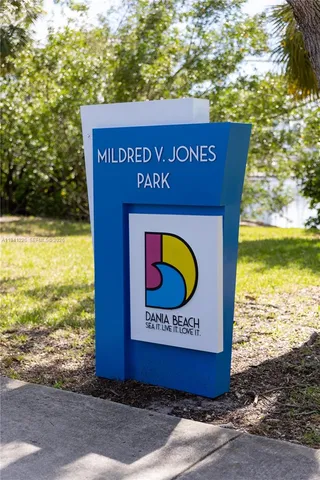 a view of a park with potted plants