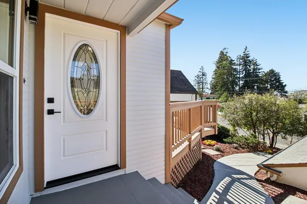 a balcony with table and chairs