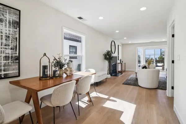 a view of a chairs and table in backyard