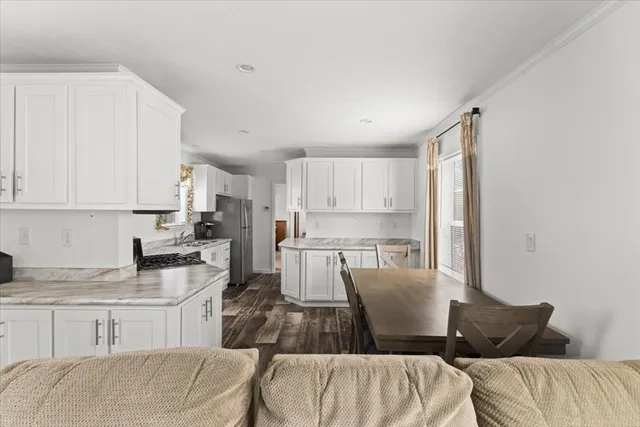 a living room with a couch and a stove top oven