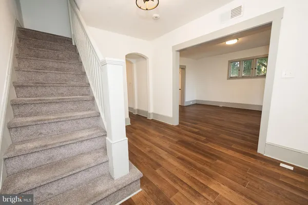 a view of an entryway with wooden floor