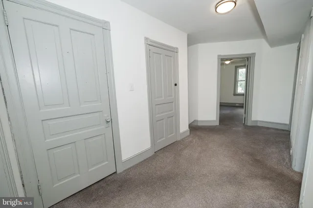 an empty room with closet area