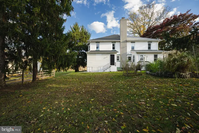 a front view of house with yard and trees