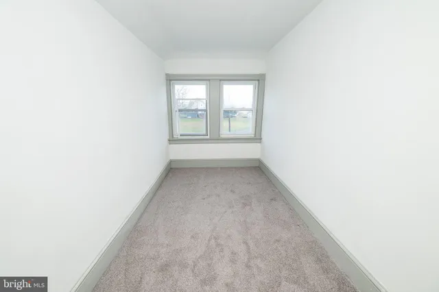a view of a room that has a window in it