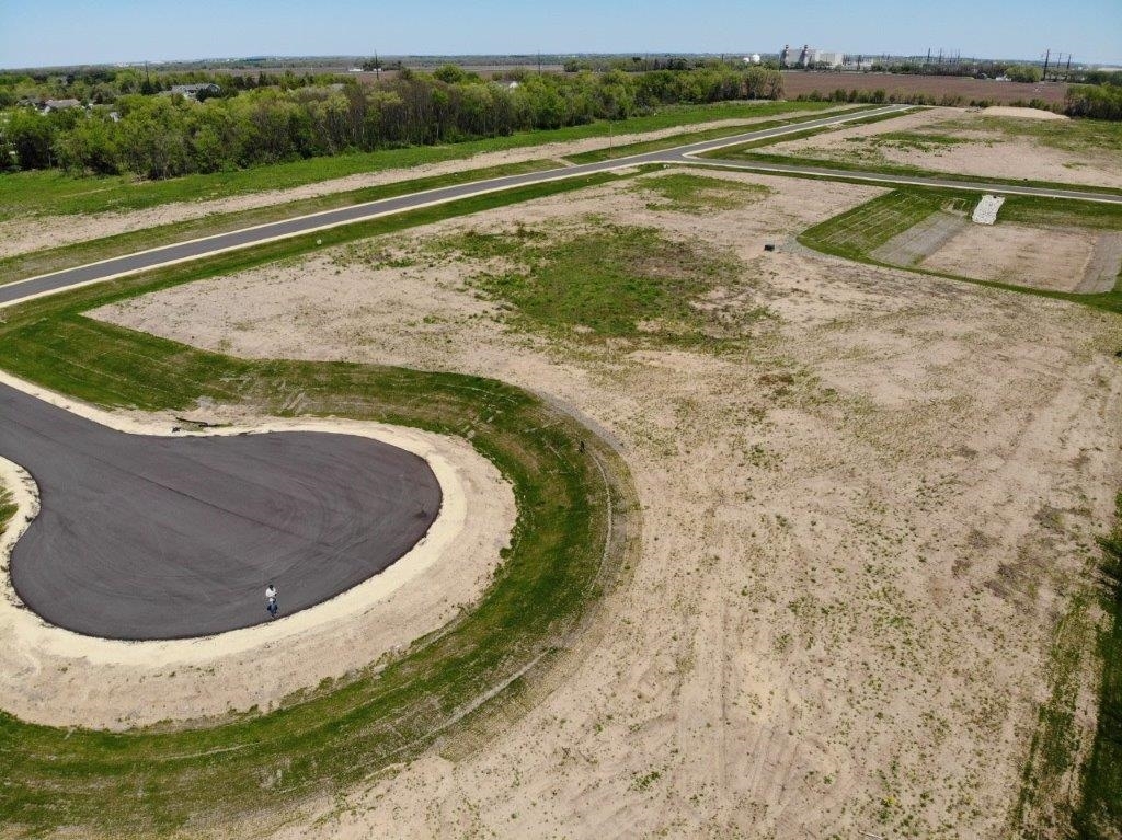 a view of a swimming pool with a yard