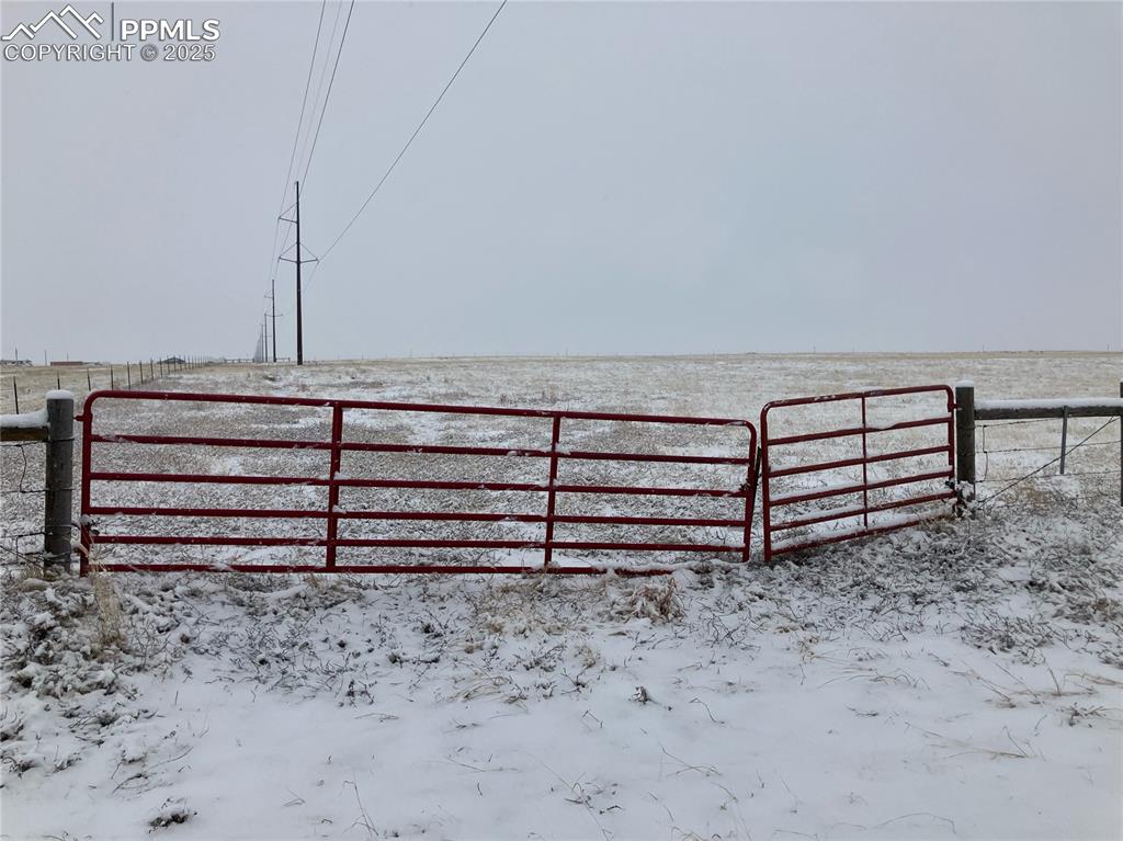 21785 Spencer Road Calhan, CO 80808 - Photo 11 of 12 a view of a bench in a yard