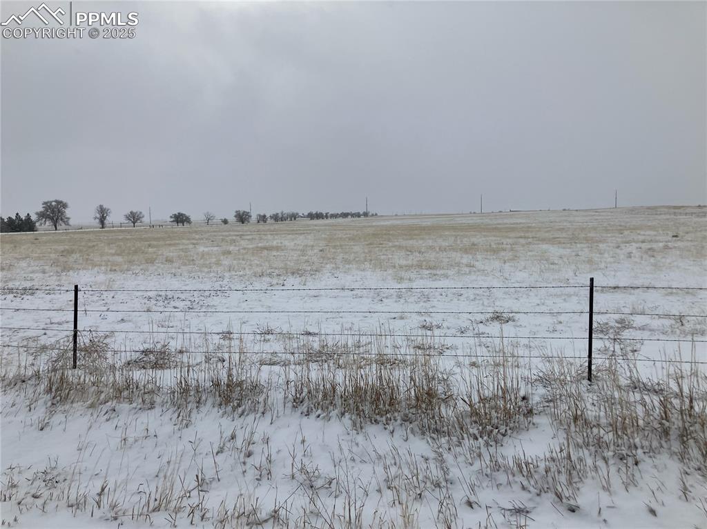 21785 Spencer Road Calhan, CO 80808 - Photo 3 of 12 a view of ocean view with beach and large trees