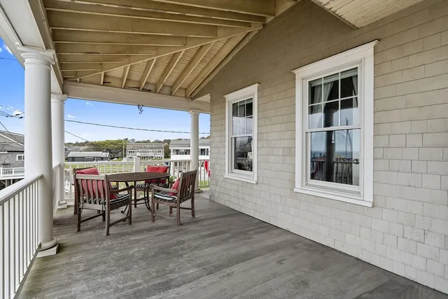 a view of a patio with table and chairs