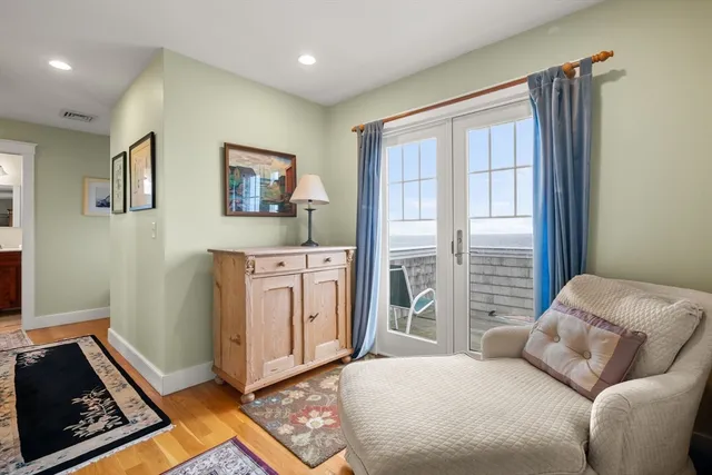 a bedroom with furniture and a window