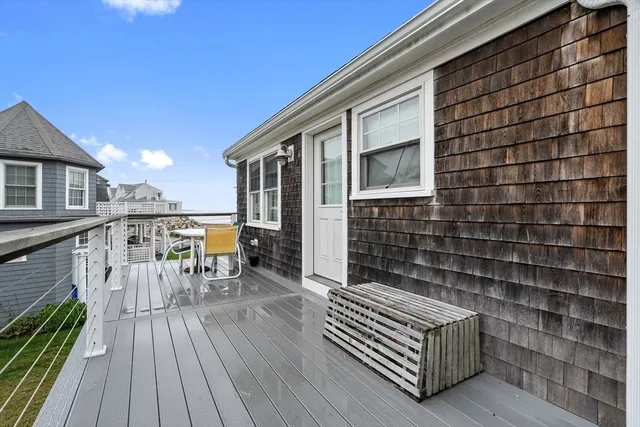 a balcony with furniture and a stove