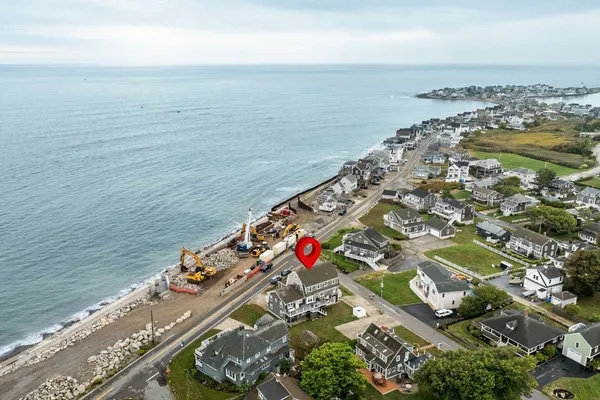 an aerial view of a house with a garden