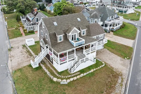 an aerial view of a house with outdoor space