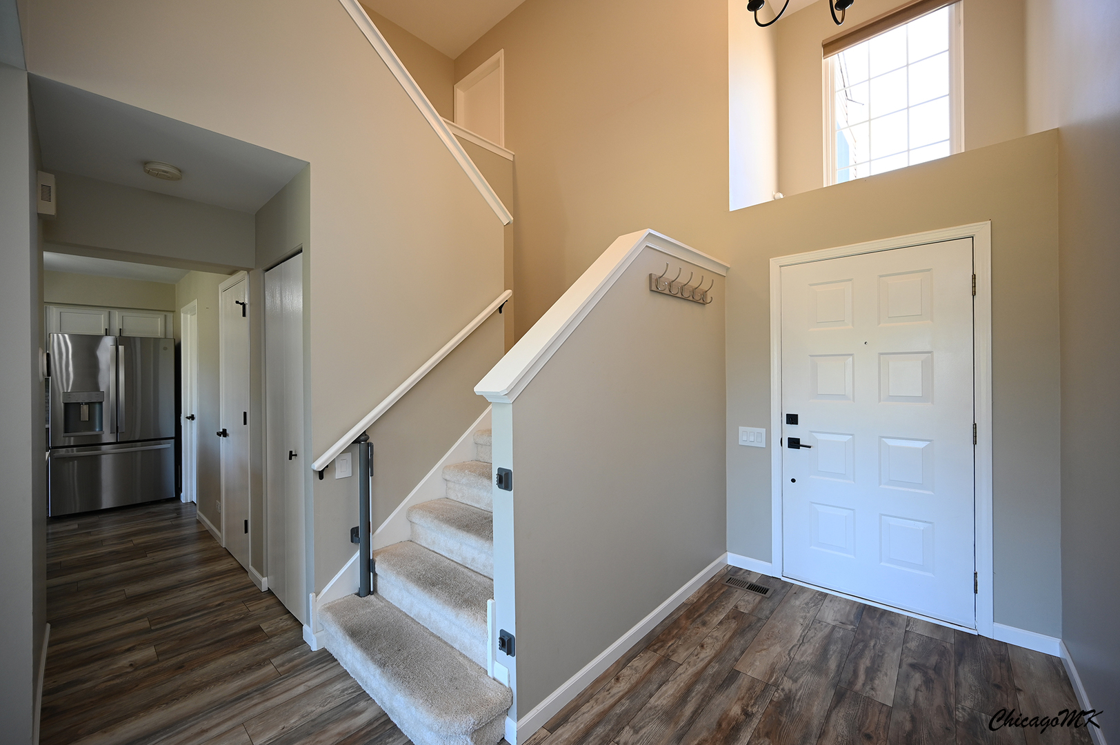 425 Locksley Drive Streamwood, IL 60107 - Photo 19 of 48 a view of a hallway view with wooden floor and staircase