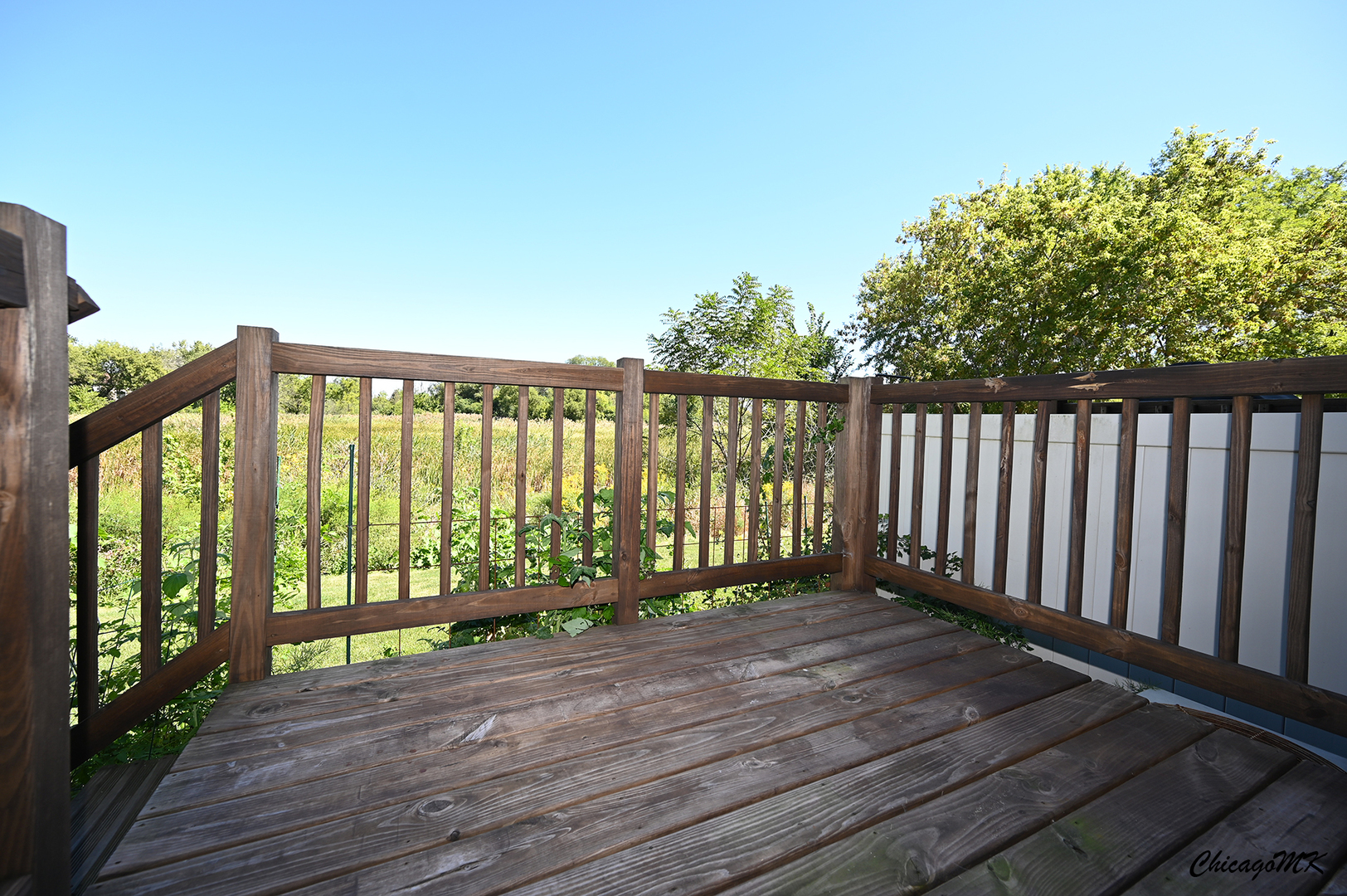 425 Locksley Drive Streamwood, IL 60107 - Photo 38 of 48 a view of deck with wooden floor and fence