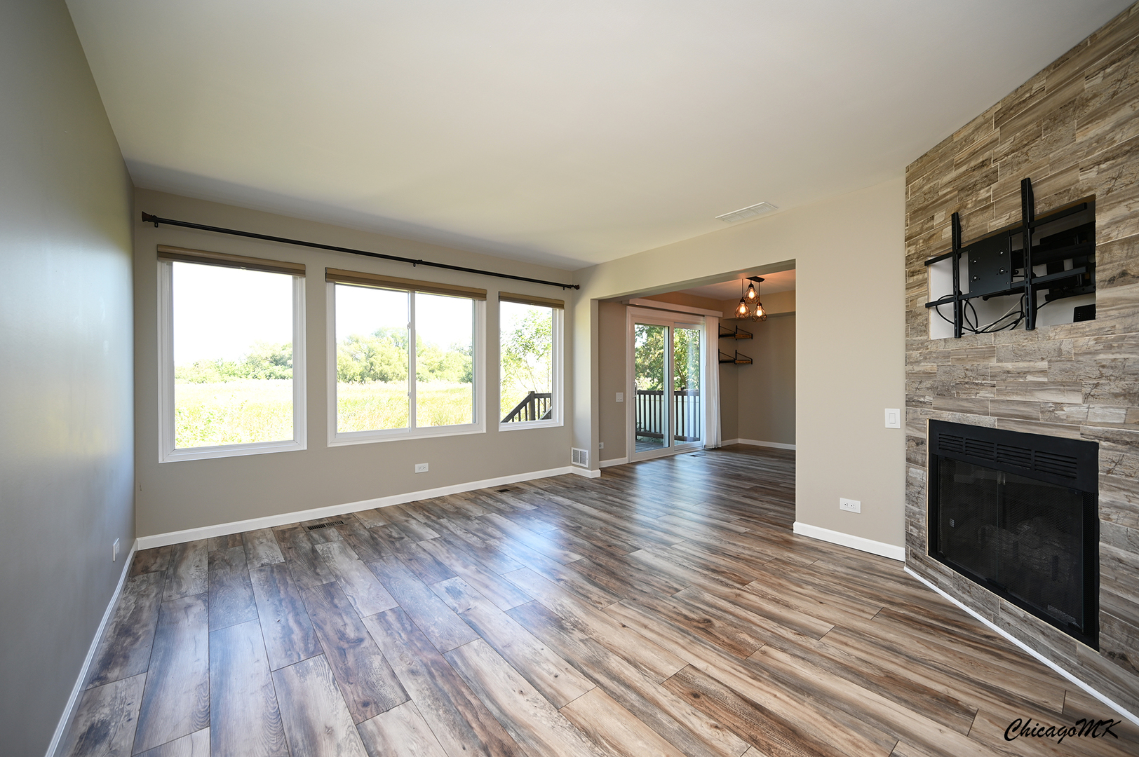 425 Locksley Drive Streamwood, IL 60107 - Photo 4 of 48 wooden floor fireplace and windows in an empty room
