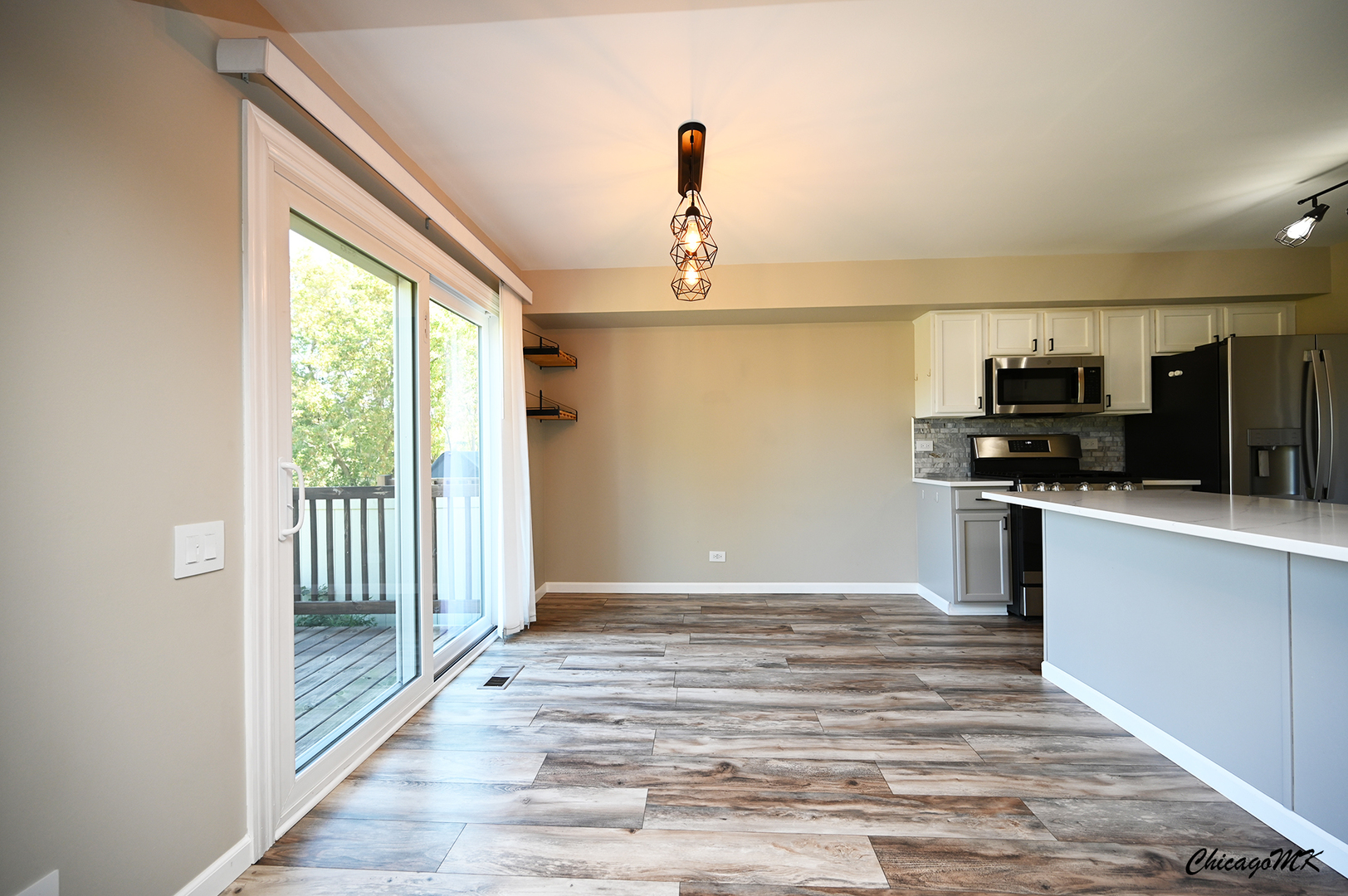 425 Locksley Drive Streamwood, IL 60107 - Photo 8 of 48 a view of a kitchen with wooden floor electronic appliances and windows