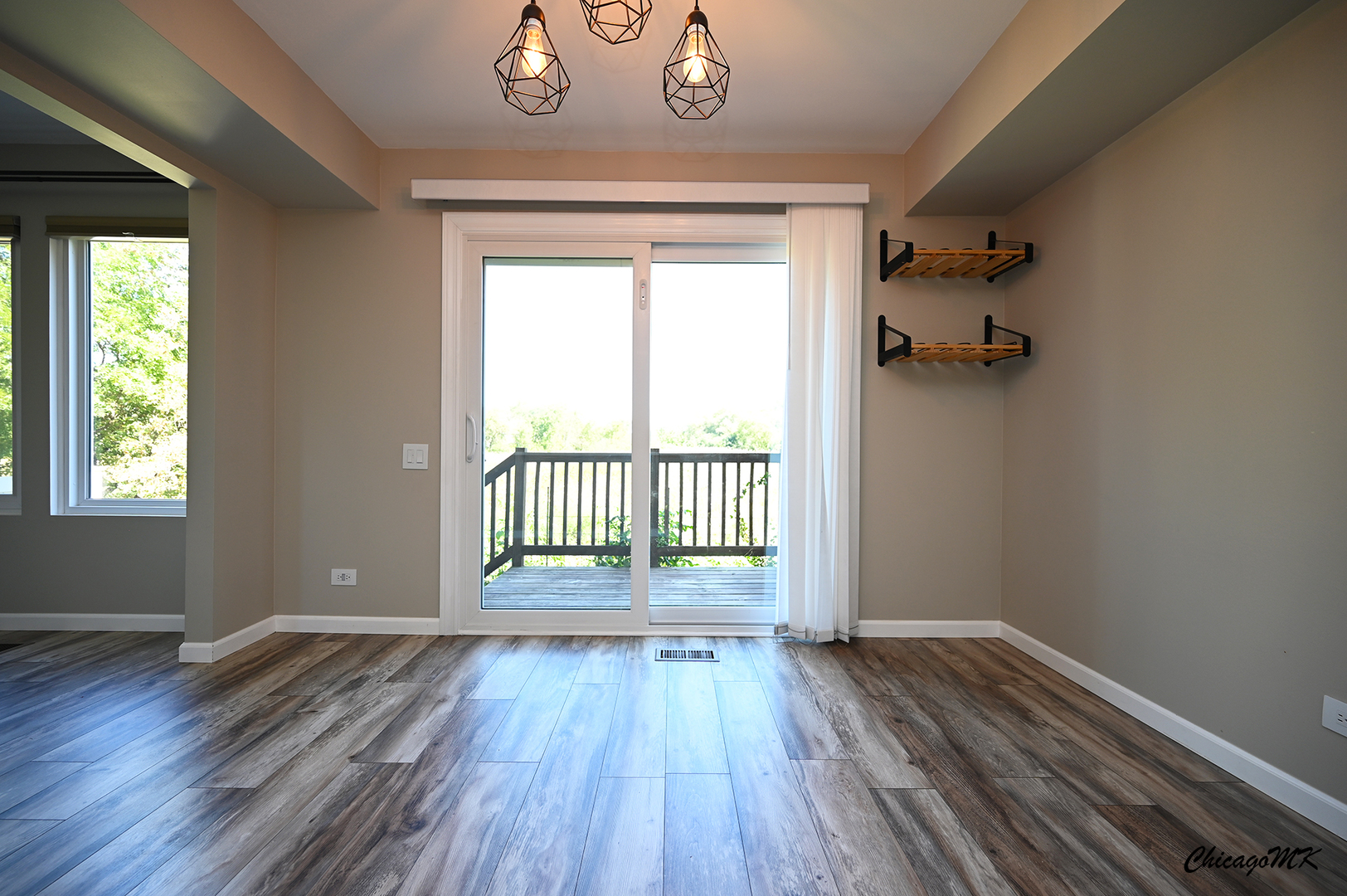 425 Locksley Drive Streamwood, IL 60107 - Photo 9 of 48 a view of a hallway with wooden floor and a window