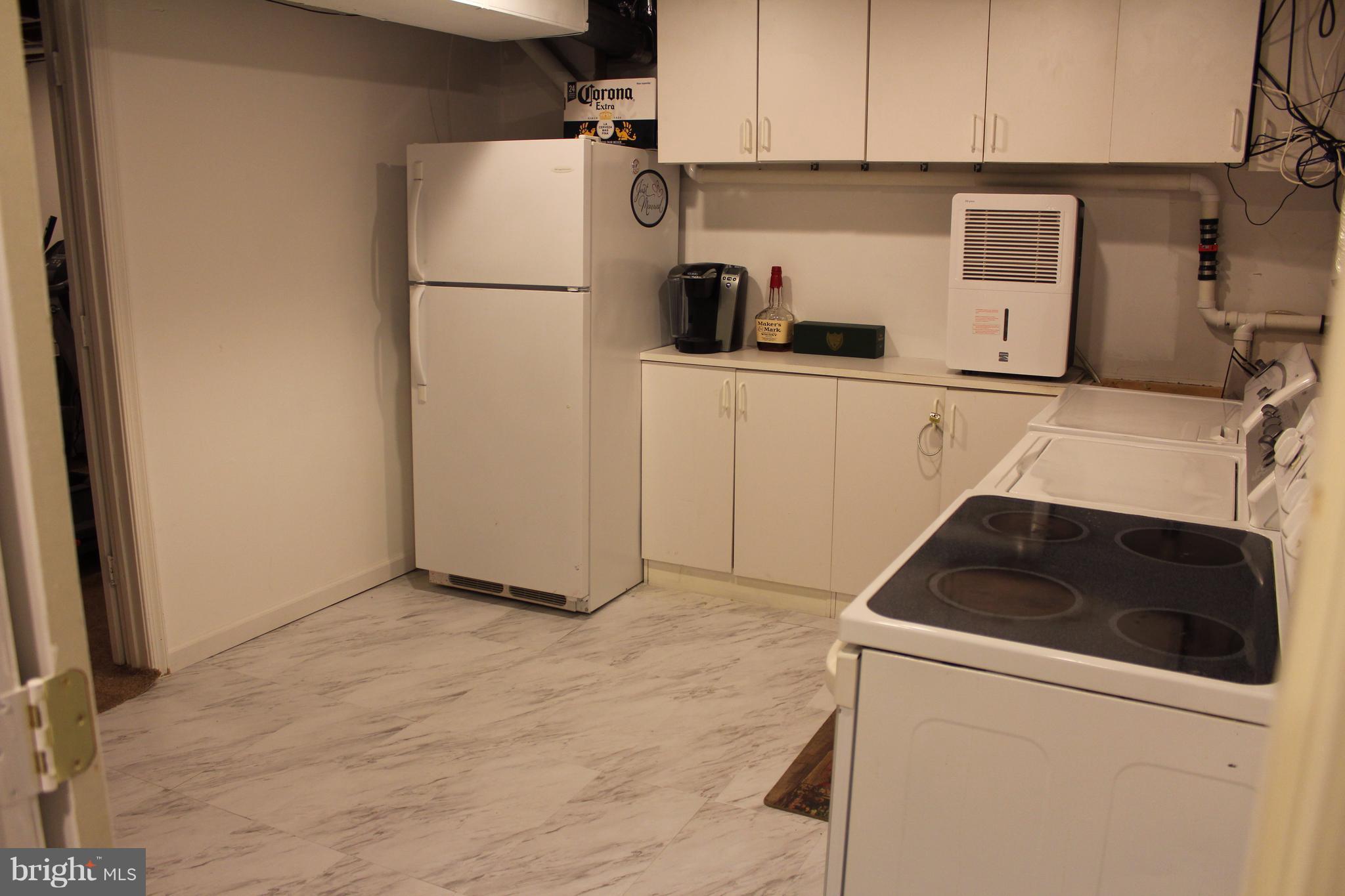 511 Maple Ridge Lane Odenton, MD 21113 - Photo 26 of 30 Basement laundry and extra kitchen area
