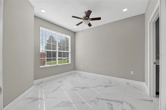 a view of an empty room with a window