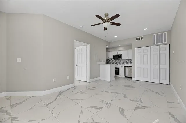 a view of a kitchen with a sink and cabinet