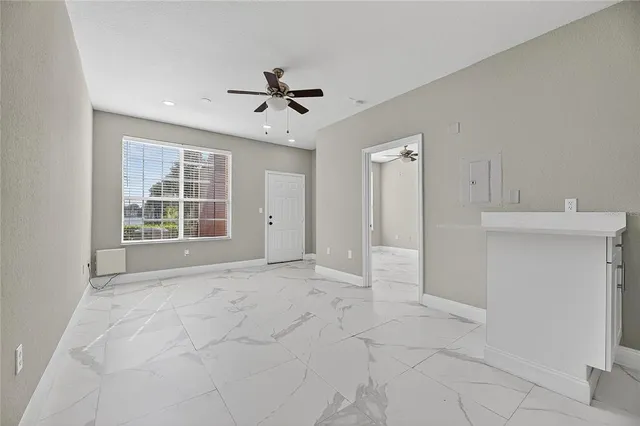 a view of an empty room with a window