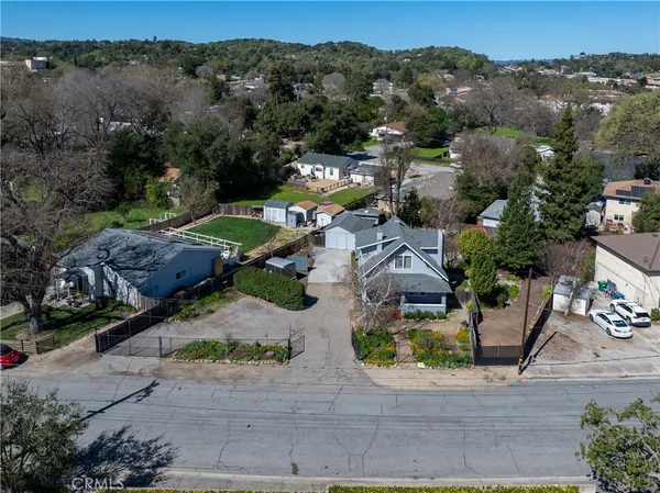 an aerial view of a house with outdoor space