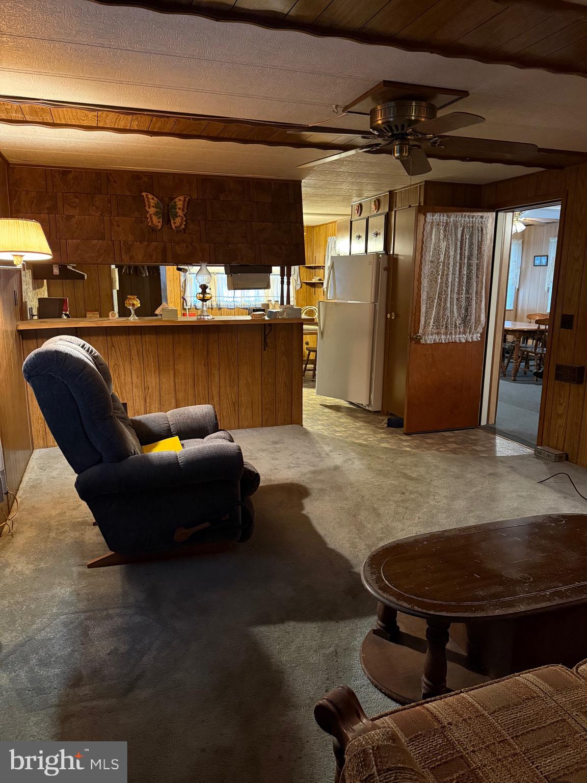 11493 Ross Lane Delmar, DE 19940 - Photo 4 of 10 a living room with furniture and a chandelier