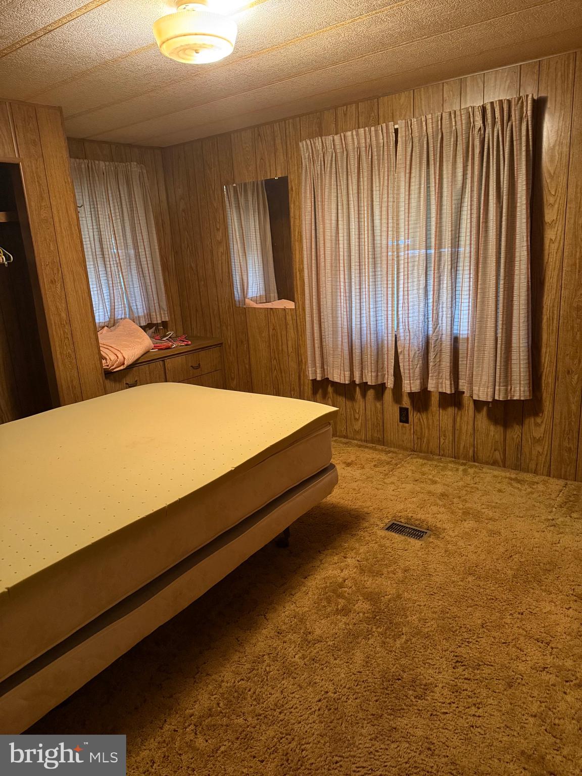 11493 Ross Lane Delmar, DE 19940 - Photo 9 of 10 a bed sitting in a spacious bathroom next to a window