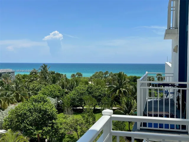 a view of a balcony with chairs