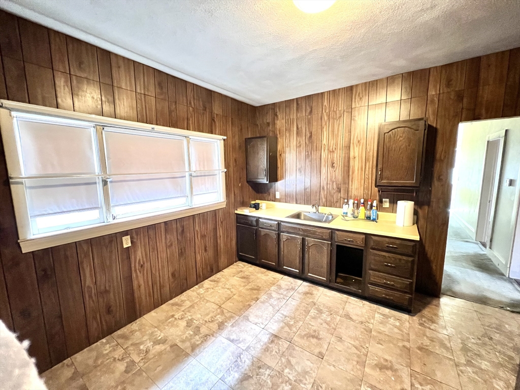 441 Winthrop Street Winthrop, MA 02152 - Photo 3 of 10 a kitchen with stainless steel appliances kitchen island granite countertop a sink stove and cabinets