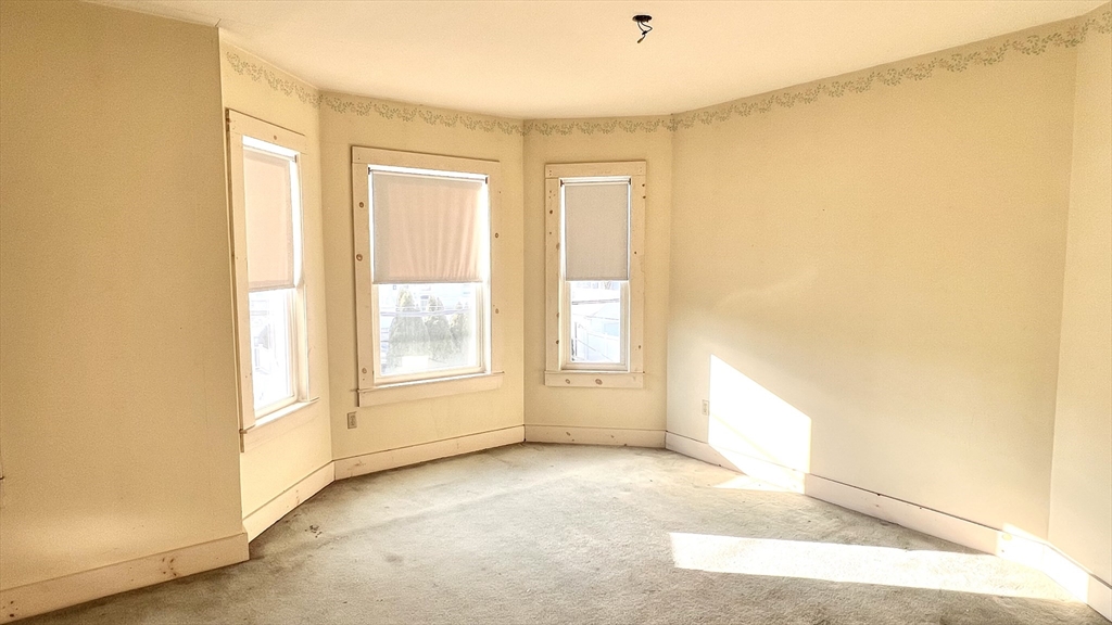 441 Winthrop Street Winthrop, MA 02152 - Photo 6 of 10 a view of an empty room with a window