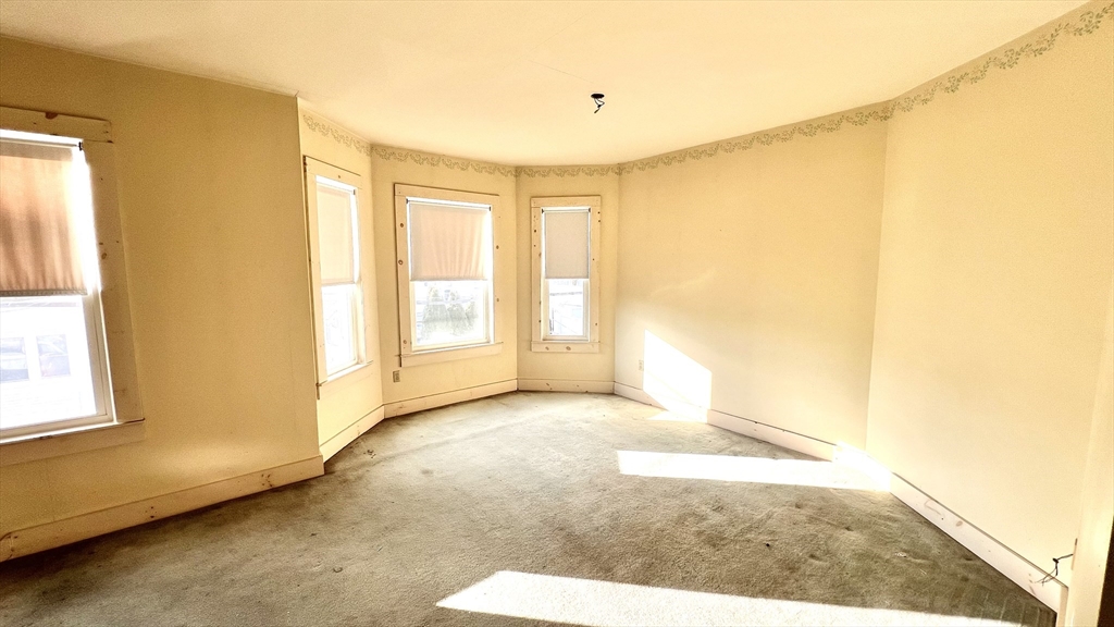 441 Winthrop Street Winthrop, MA 02152 - Photo 7 of 10 a view of an empty room with a window