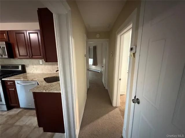 a view of a kitchen from a closet