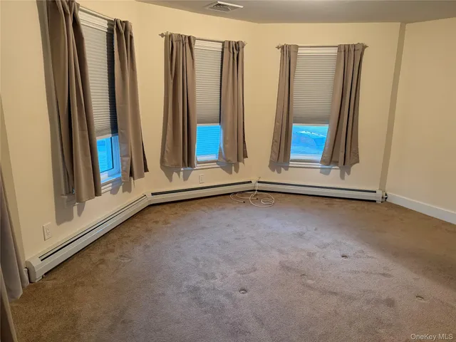 a view of a room with large windows