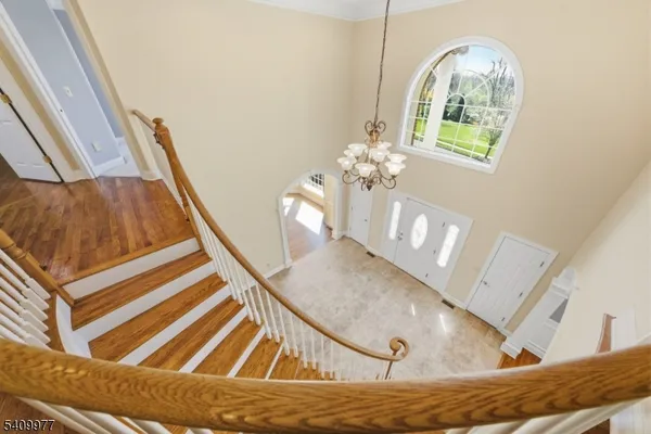 a view of a hallway view with staircase