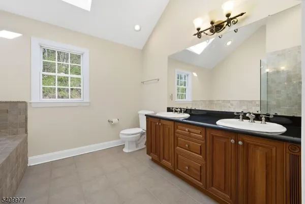 a bathroom with a bathtub and shower