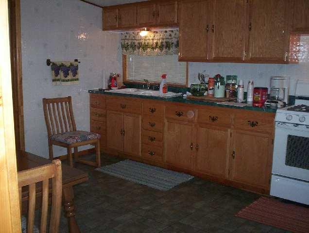 74 225th Road Rifle, CO 81650 - Photo 3 of 5 a kitchen with cabinets a sink and appliances