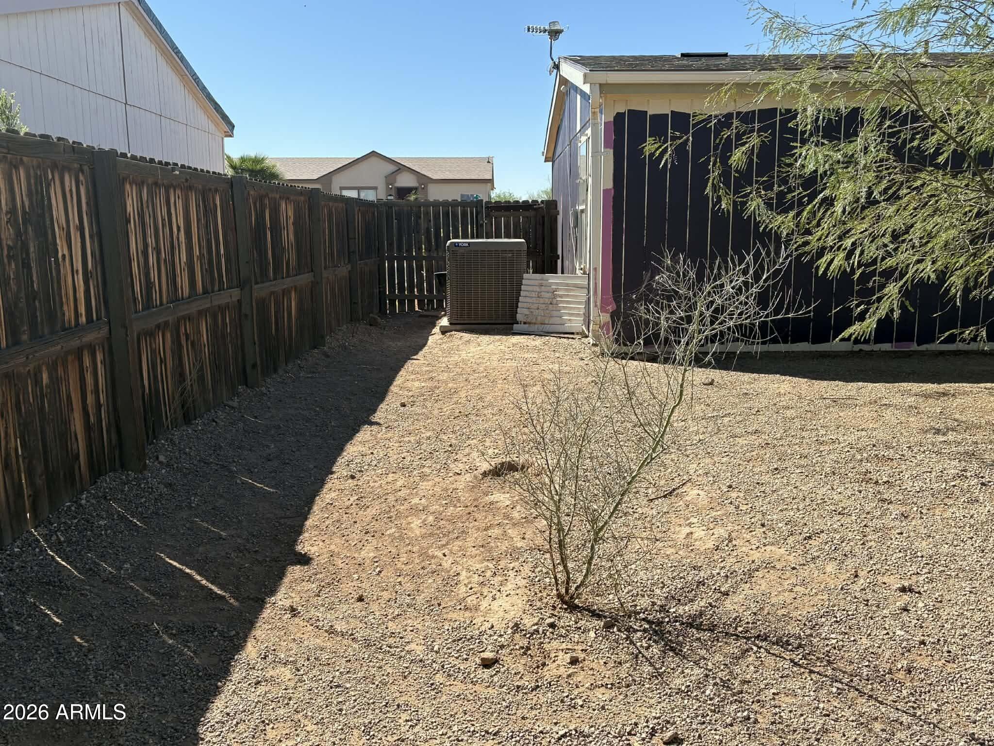11558 Stagecoach Road Arizona City, AZ 85123 - Photo 2 of 3 a view of a backyard with pathway