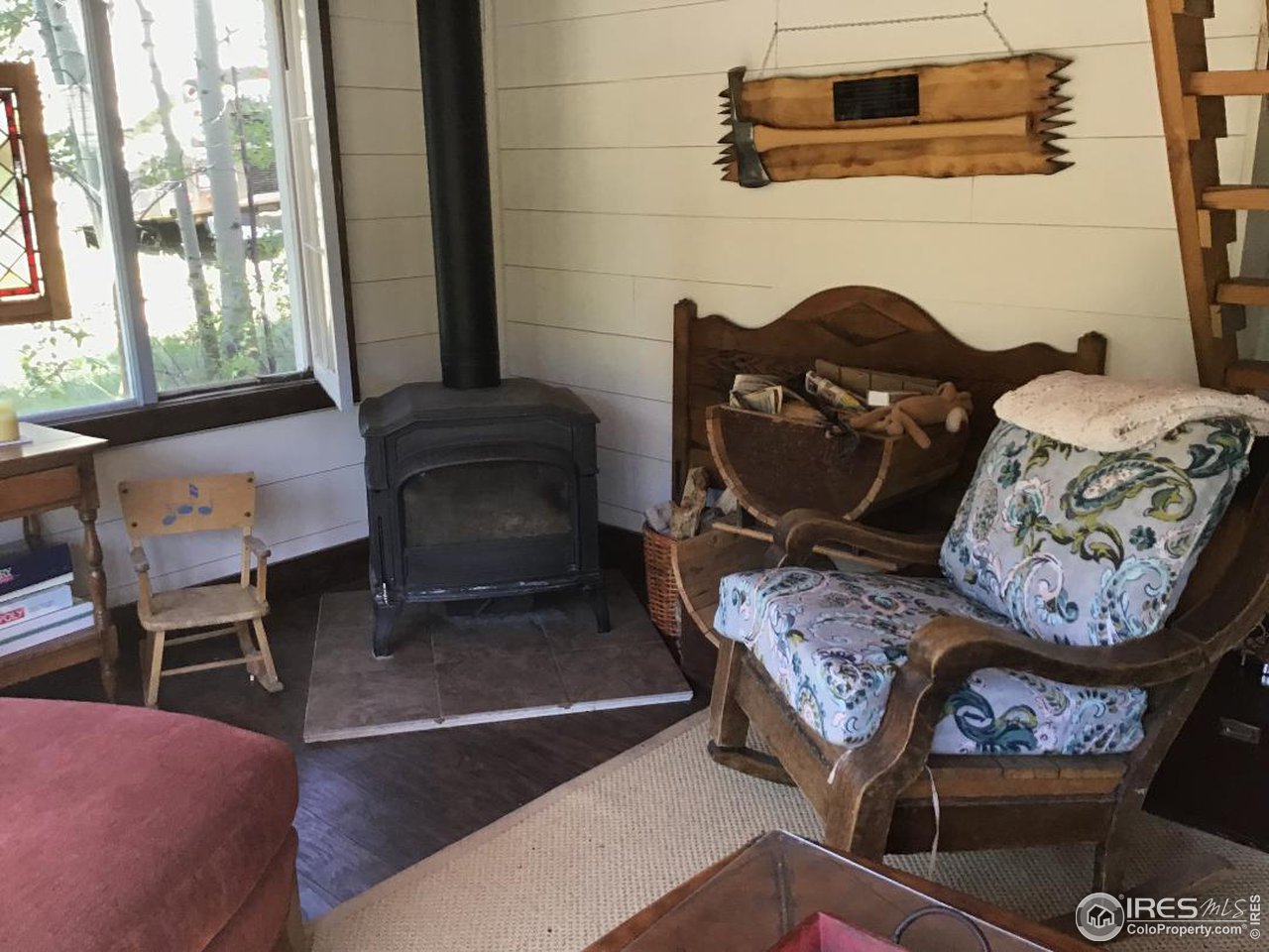 living room with free standing fireplace