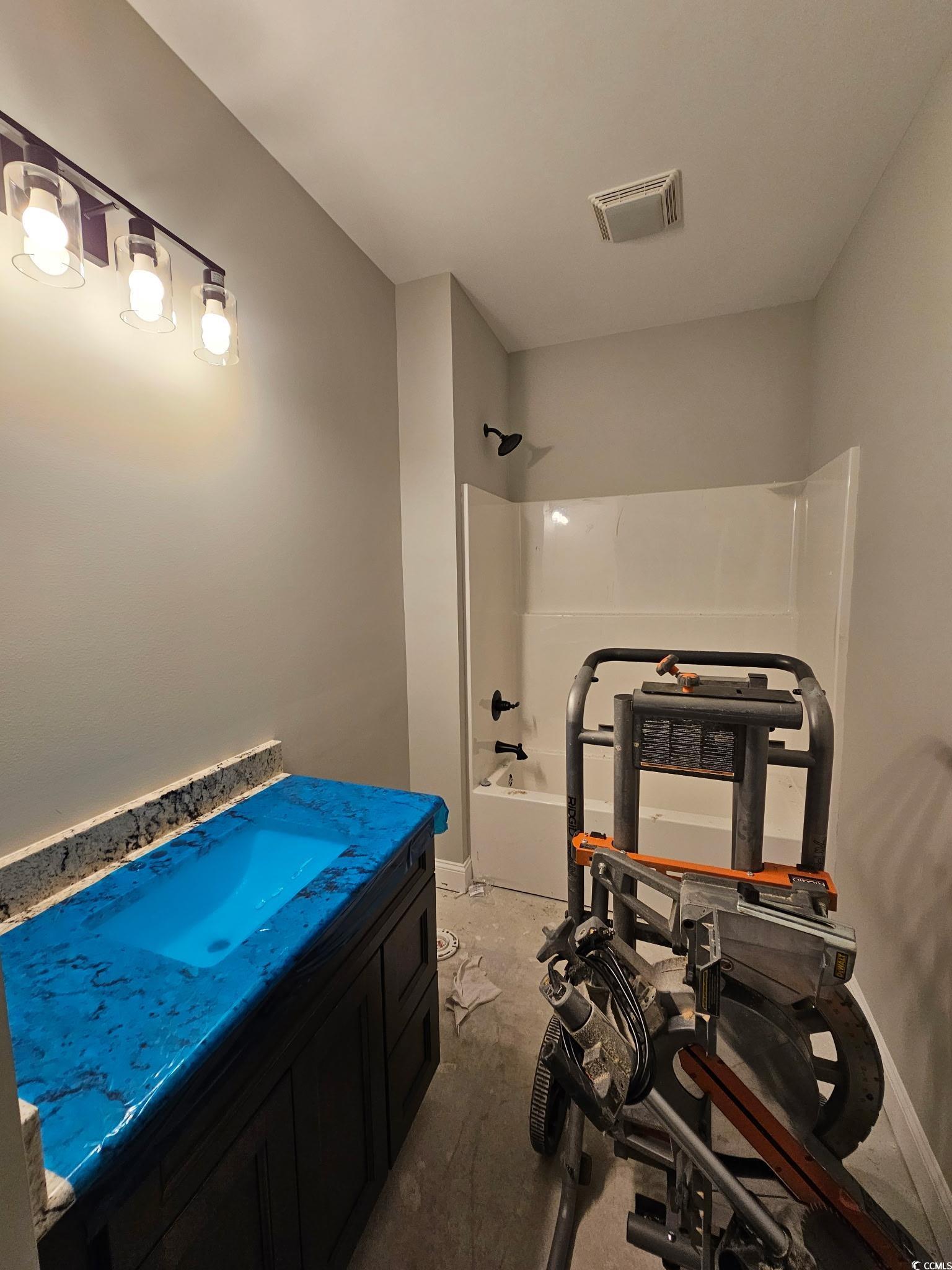 8012 Old Reaves Ferry Road Conway, SC 29526 - Photo 11 of 23 Bathroom featuring vanity, shower / bath combinati