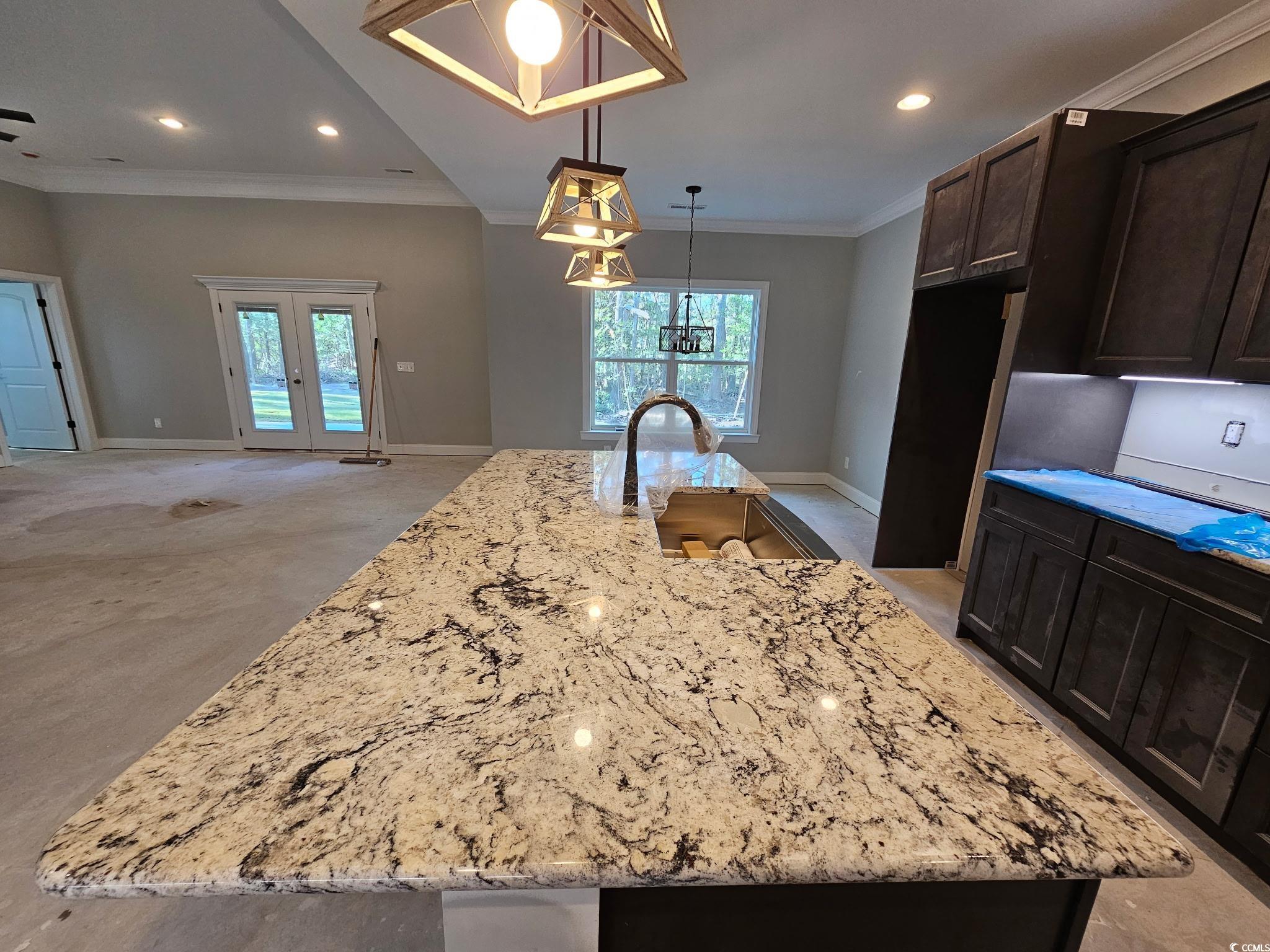 8012 Old Reaves Ferry Road Conway, SC 29526 - Photo 9 of 23 Kitchen featuring crown molding, a spacious island