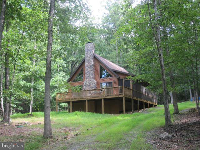 688 Fern Valley Way Springfield, WV 26763 - Photo 1 of 22 a house that has a tree in it