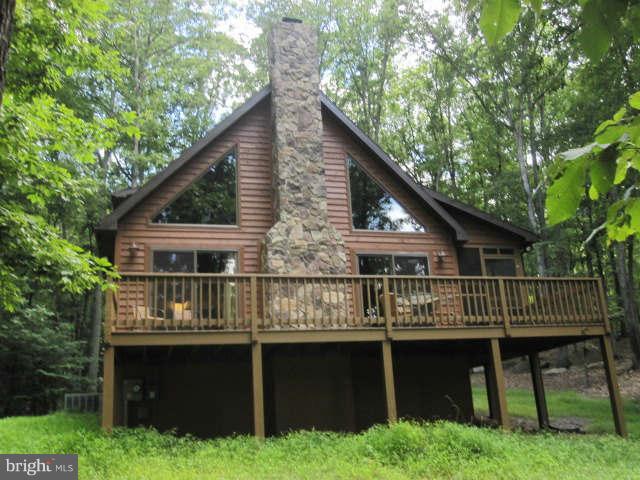 688 Fern Valley Way Springfield, WV 26763 - Photo 2 of 22 a balcony with wooden fence and deck