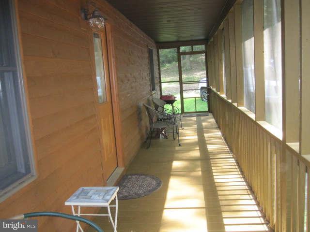 688 Fern Valley Way Springfield, WV 26763 - Photo 13 of 22 a view of a balcony with wooden floor