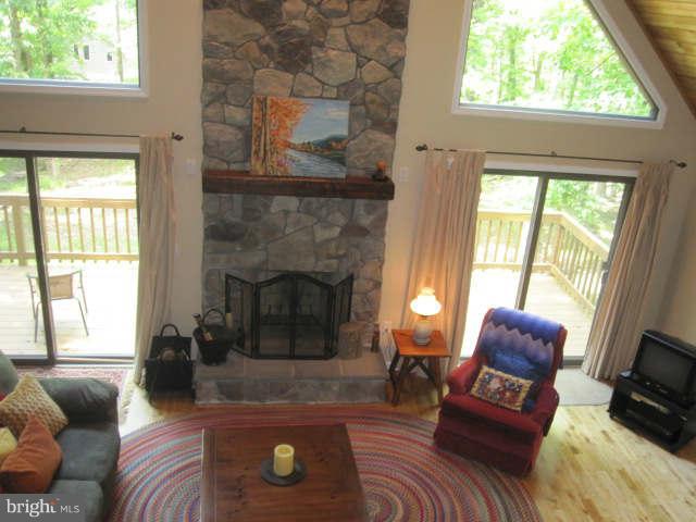 688 Fern Valley Way Springfield, WV 26763 - Photo 14 of 22 a living room with furniture and a fireplace