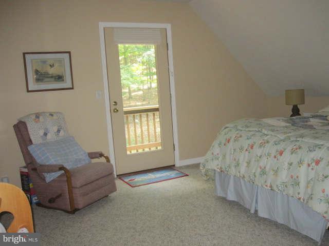 688 Fern Valley Way Springfield, WV 26763 - Photo 16 of 22 a bedroom with a bed and a couch