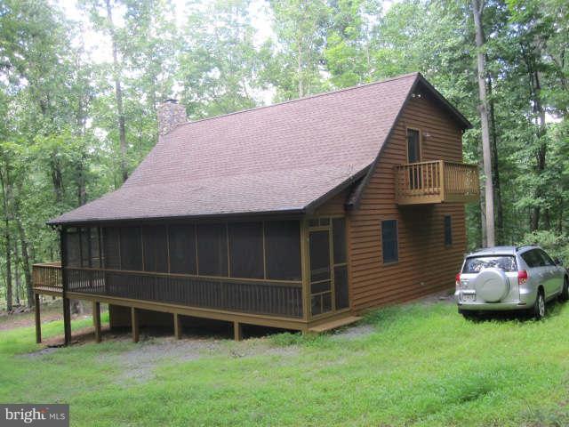 688 Fern Valley Way Springfield, WV 26763 - Photo 18 of 22 a front view of a house with a garden