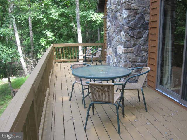 688 Fern Valley Way Springfield, WV 26763 - Photo 4 of 22 a view of balcony with table and chairs