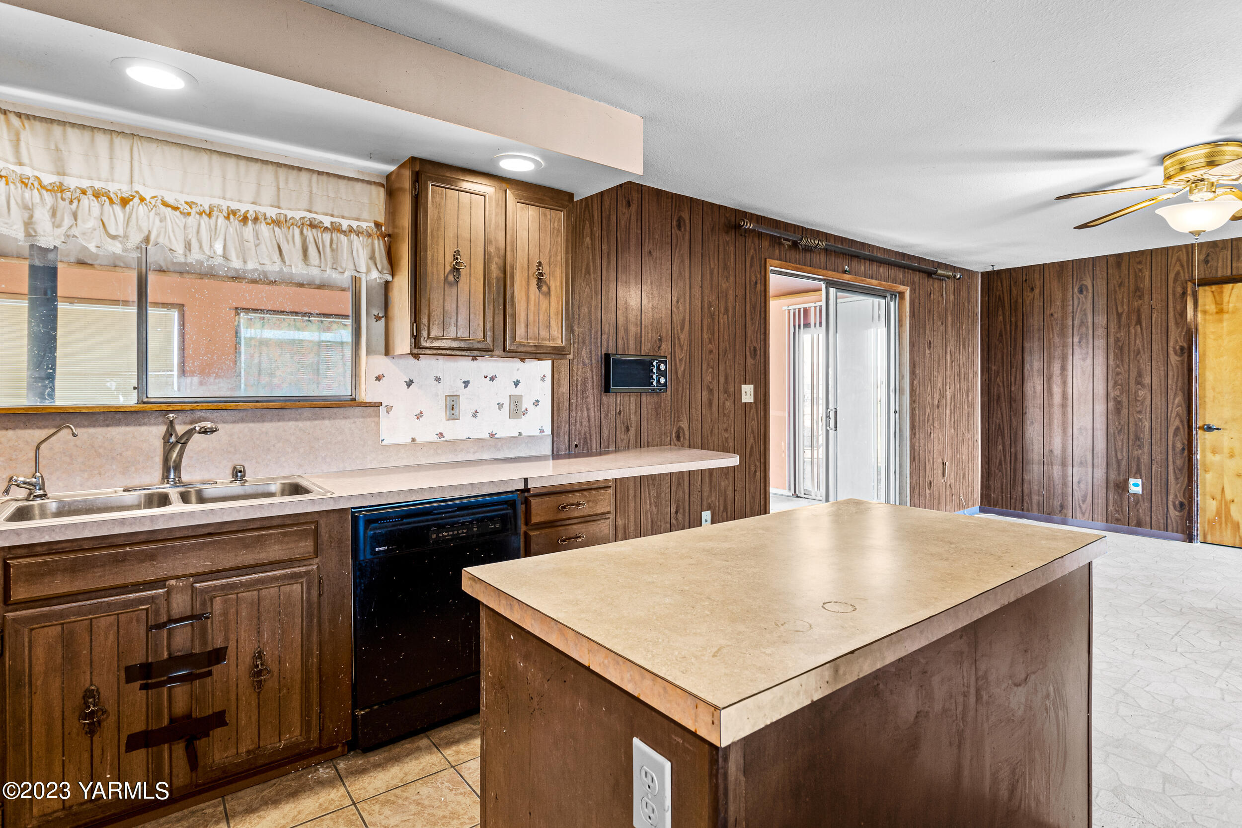 3570 Lateral B Road Wapato, WA 98951 - Photo 16 of 32 a kitchen with a stove a sink a cabinets and a refrigerator